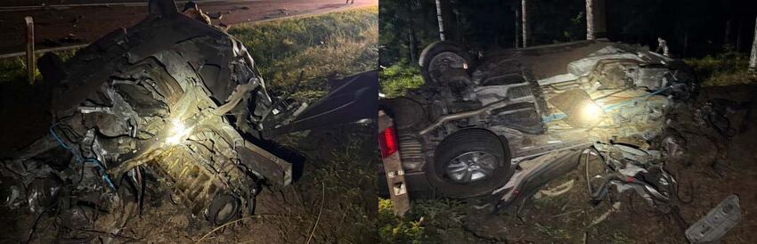 Wrak bmw leżący na dachu po nocnym wypadku